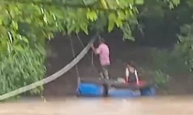 Pai atravessa rio com balsa adaptada para deixar filha na escola, em Crixás de Goiás